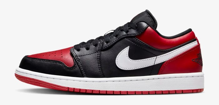 Side view of a black and red Air Jordan 1 Low sneaker.
